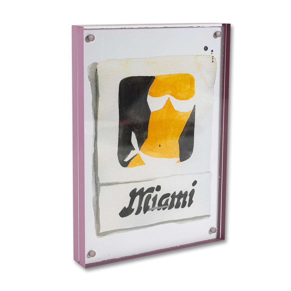 Miami Matchbook - Furbish Studio, Miami matchbook watercolor print illustrating the body of a lady with a black background of paint enclosed in a 5" x 7" mauve magnetic acrylic floating frame facing a side view