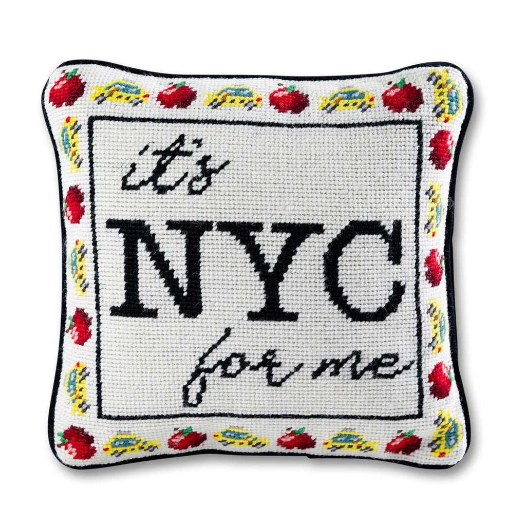 front view of the luxe black velvet chic hand needlepoint pillow with "it's NYC for me" saying written in black surrounded by small yellow cars and cherries with a white background