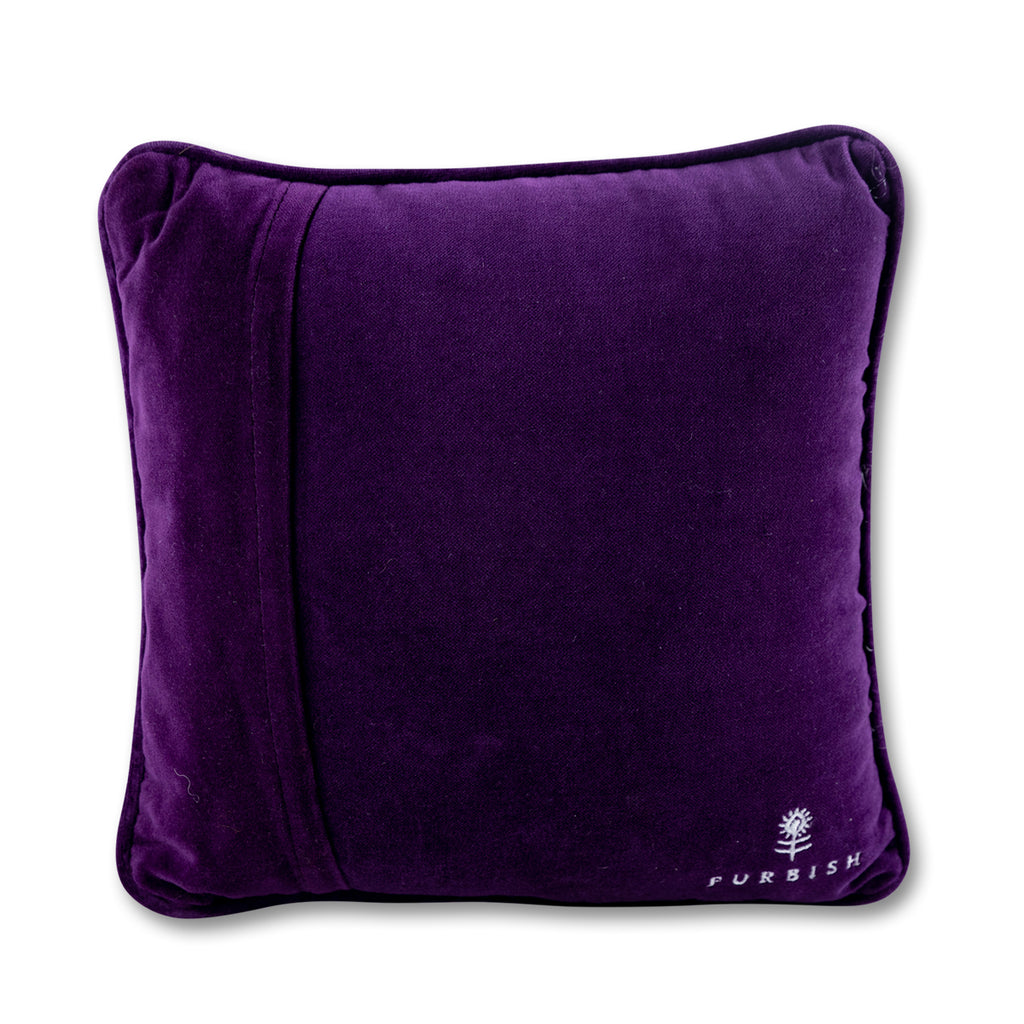 back view of the luxe purple velvet chic hand needlepoint pillow with a furbish text print and logo located on the bottom right-hand corner of the pillow