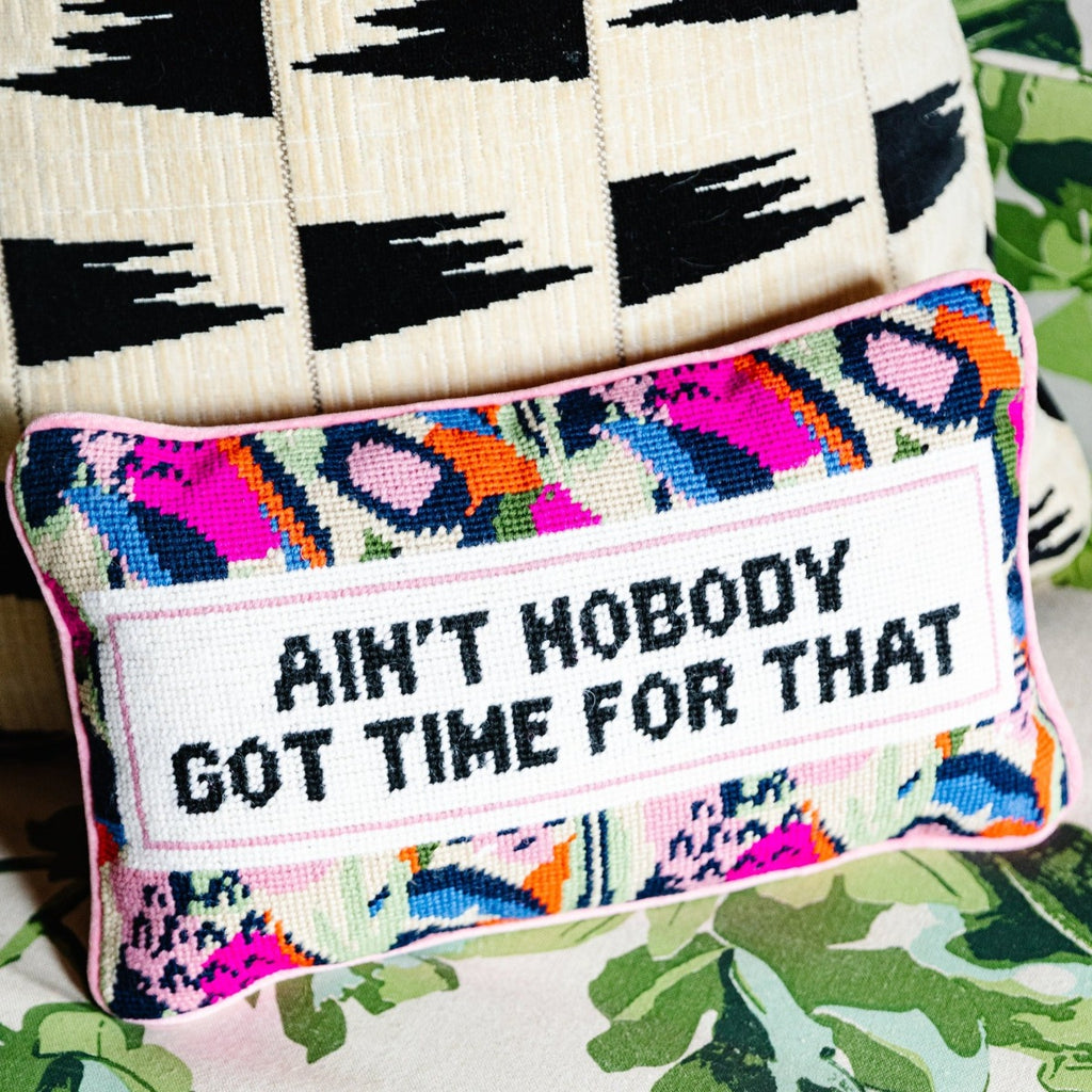 Ain't Nobody Needlepoint Pillow - Furbish Studio, a closer look at the luxe light pink velvet chic hand needlepoint pillow with a "Ain't nobody got time for that" saying in front sitting on a couch