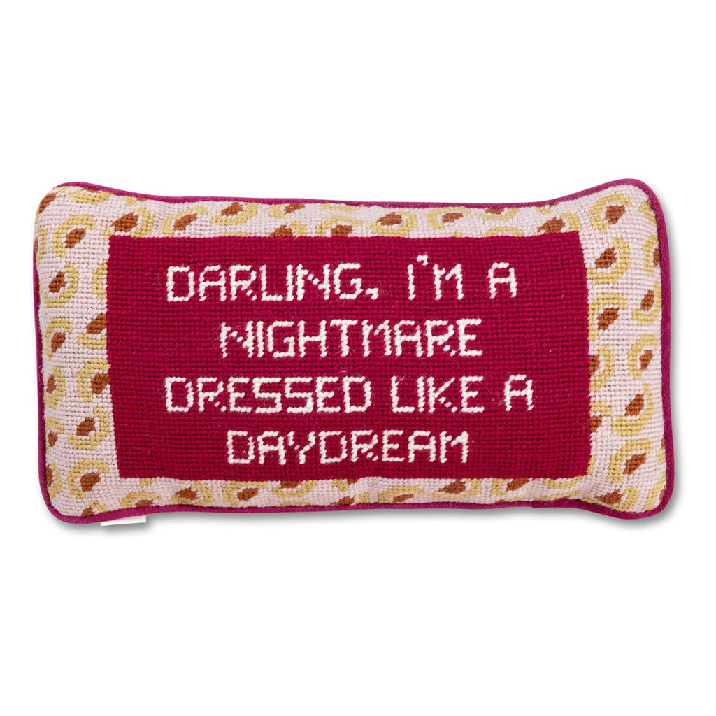  a closer look at the luxe dark pink velvet charming-meets-chic hand needlepoint pillow with "Darling, I'am a nightmare dressed like a daydream" cheeky saying in front 