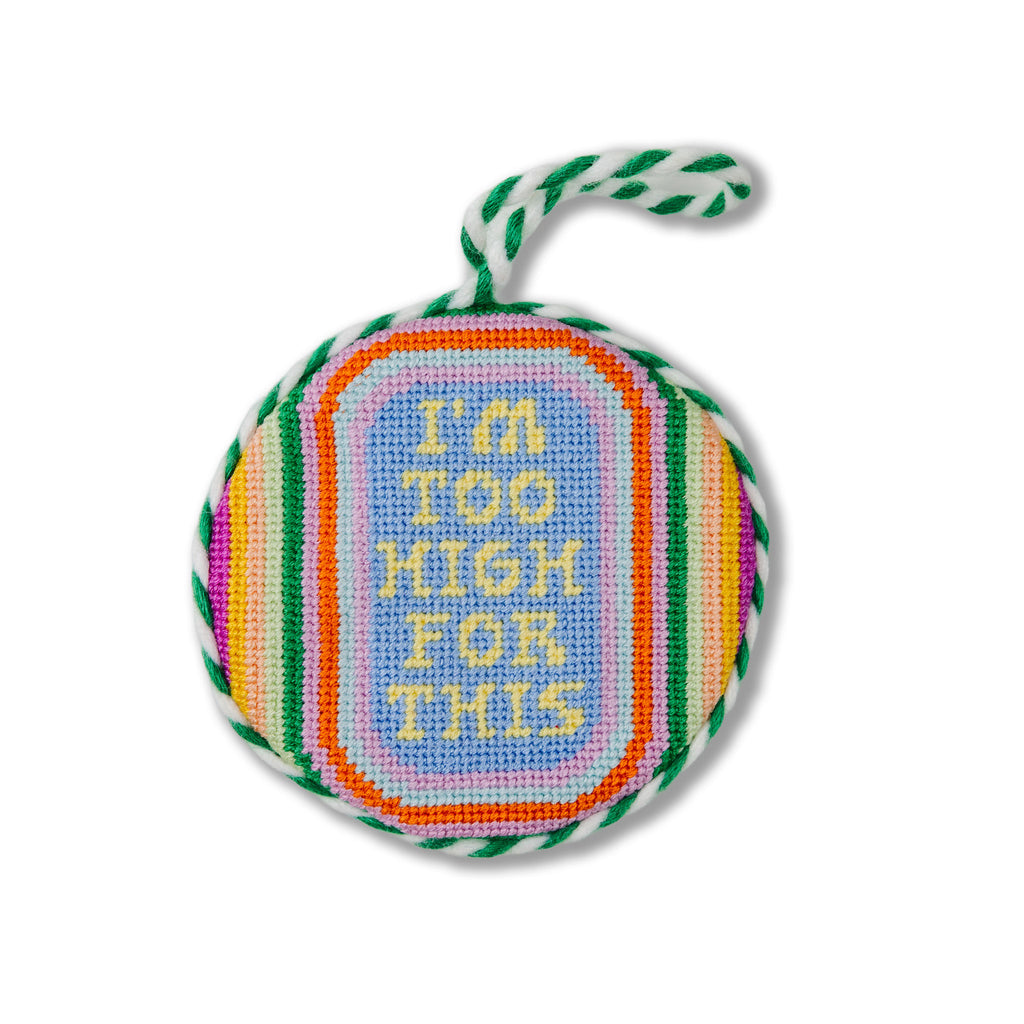 Round embroidered item with colorful border and 'I'm Too High For This' text on a white background