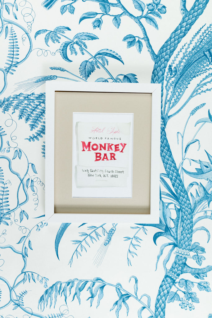 Monkey Bar Matchbook - Furbish Studio, Monkey Bar matchbook watercolor print illustrating the matchbook's title "Monkey Bar" painted in red in the middle of the archival paper in a 5"x7" white frame with a wallpaper background