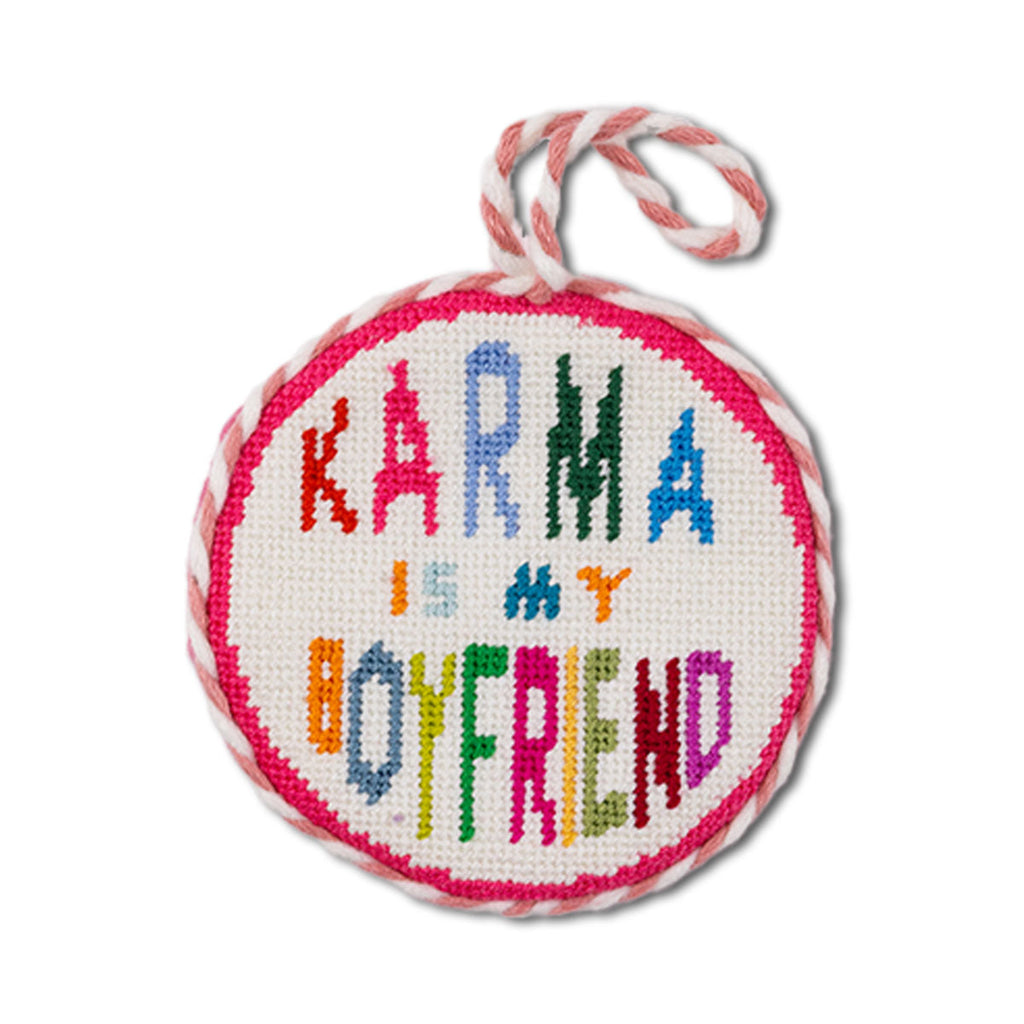 Round embroidered patch with 'Karma is my boyfriend' text on a white background