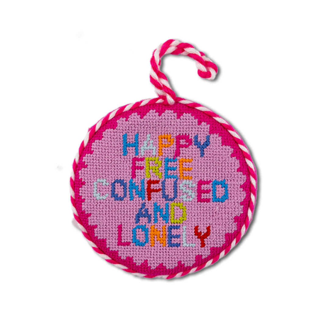 Round pink embroidered ornament with colorful text on a white background
