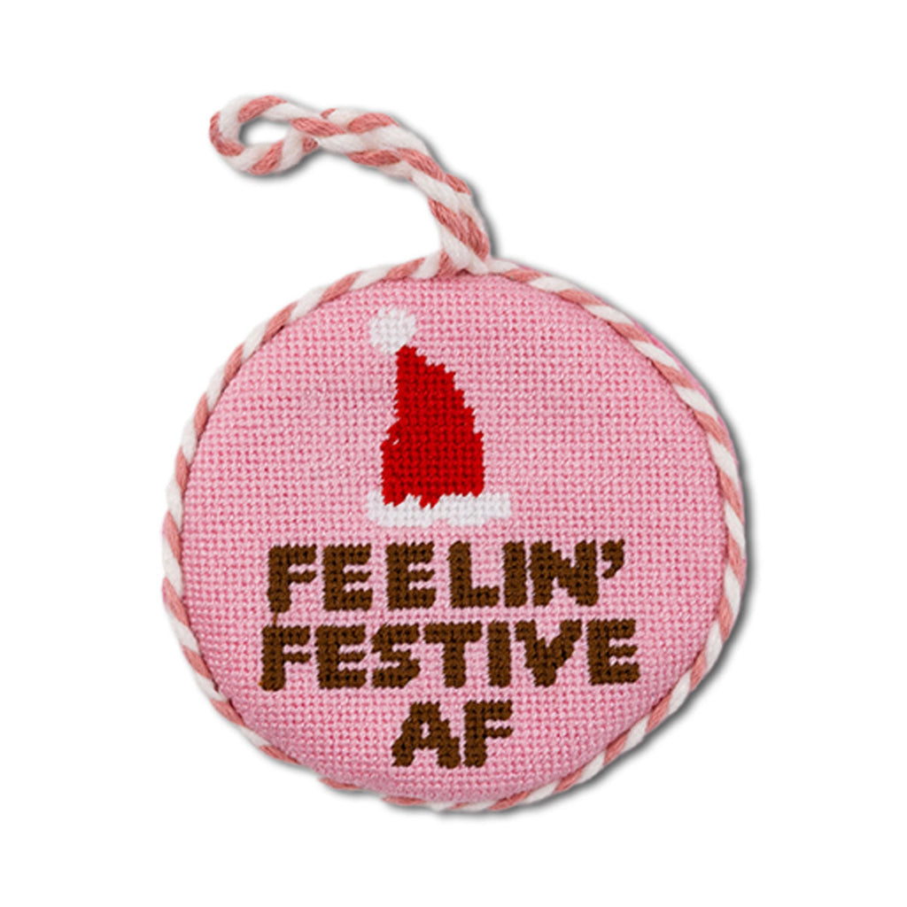 Pink ornament with red Santa hat and 'Feelin' Festive AF' text on a white background