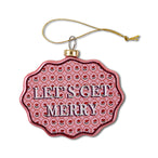 A scalloped glass Christmas ornament with a red background and the text 'LET'S GET MERRY' in white letters.