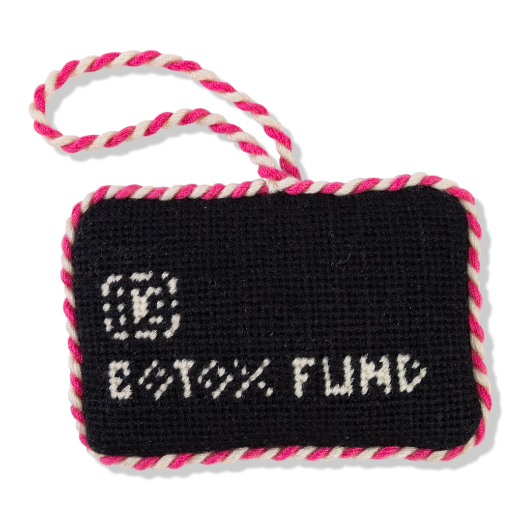 Black rectangular tag with 'Botox Fund' text and pink rope handle on a white background