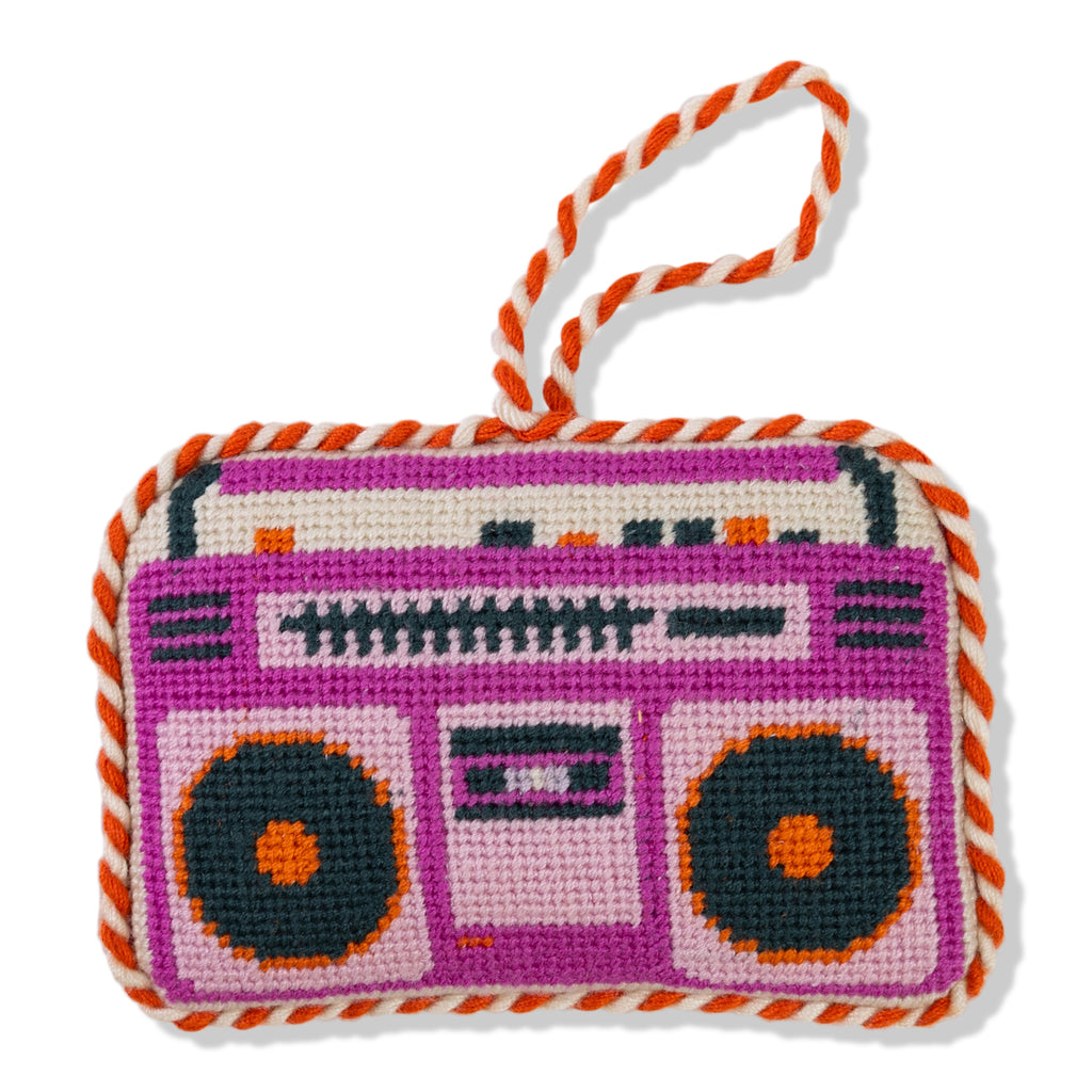 Cross-stitched design of a boombox on a white background
