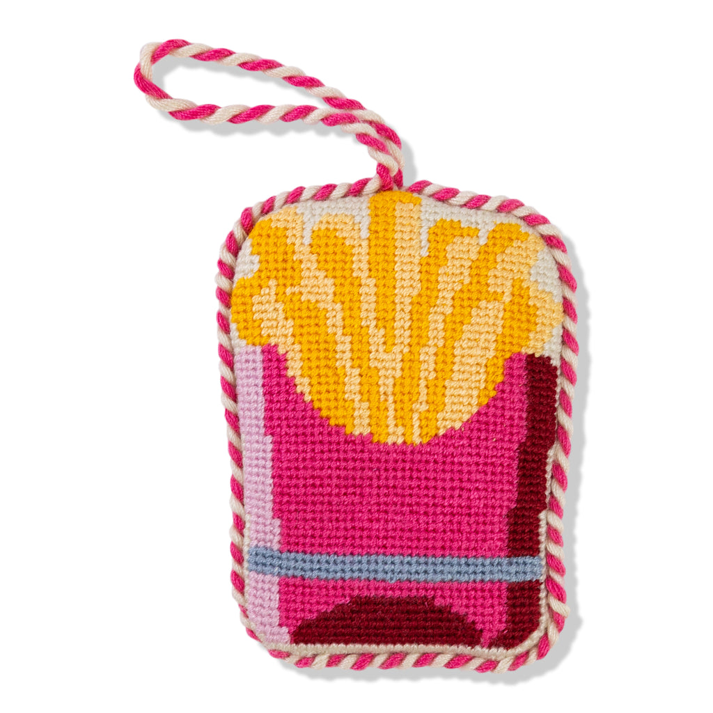 Colorful needlepoint keychain with pink and yellow design on a white background