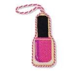 Dog toy shaped like a pink nail polish bottle with a rope handle on a white background