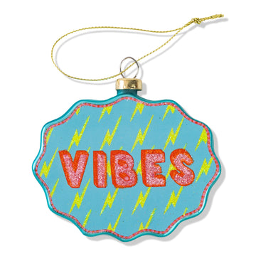 Decorative ornament with 'VIBES' text on a blue background