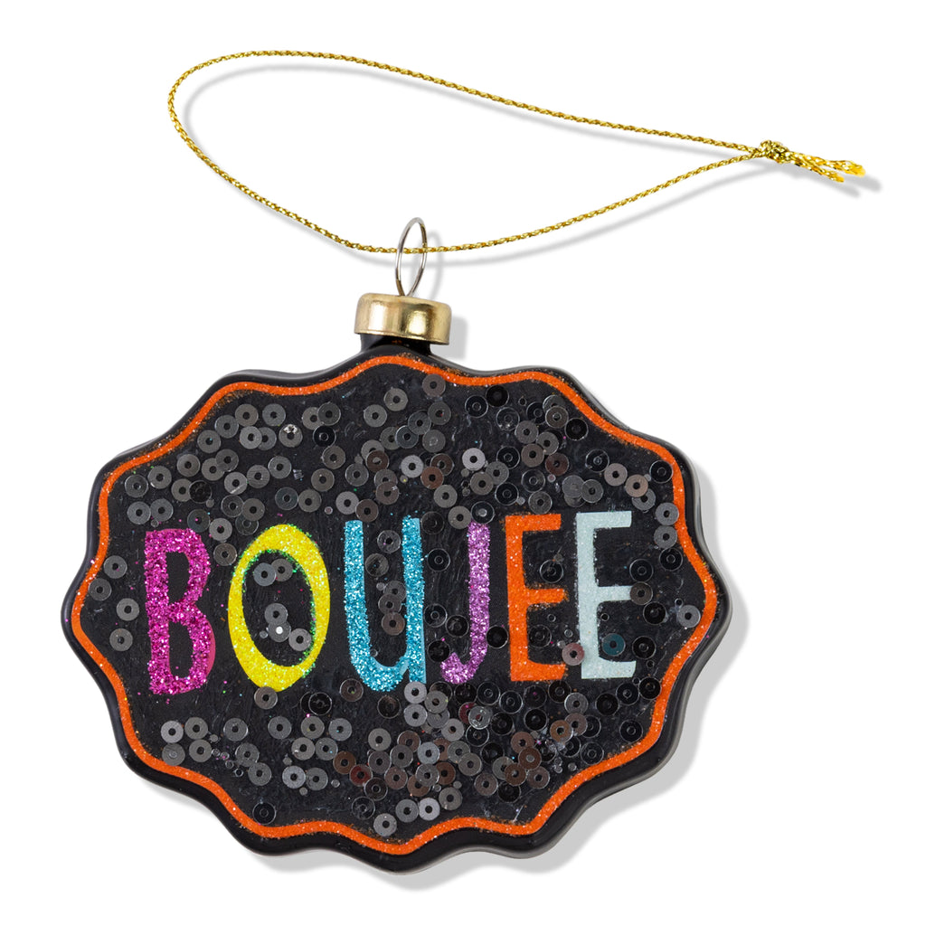 Decorative ornament with 'BOUJEE' text on a black sequined background