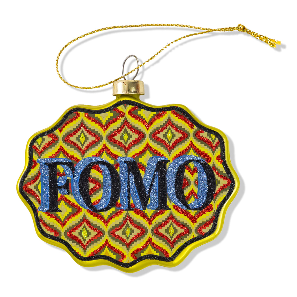 Decorative ornament with 'FOMO' text on a colorful patterned background