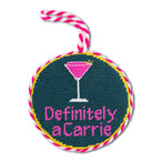 Circular embroidered patch with a martini glass and text 'Definitely a Carrie' on a white background.