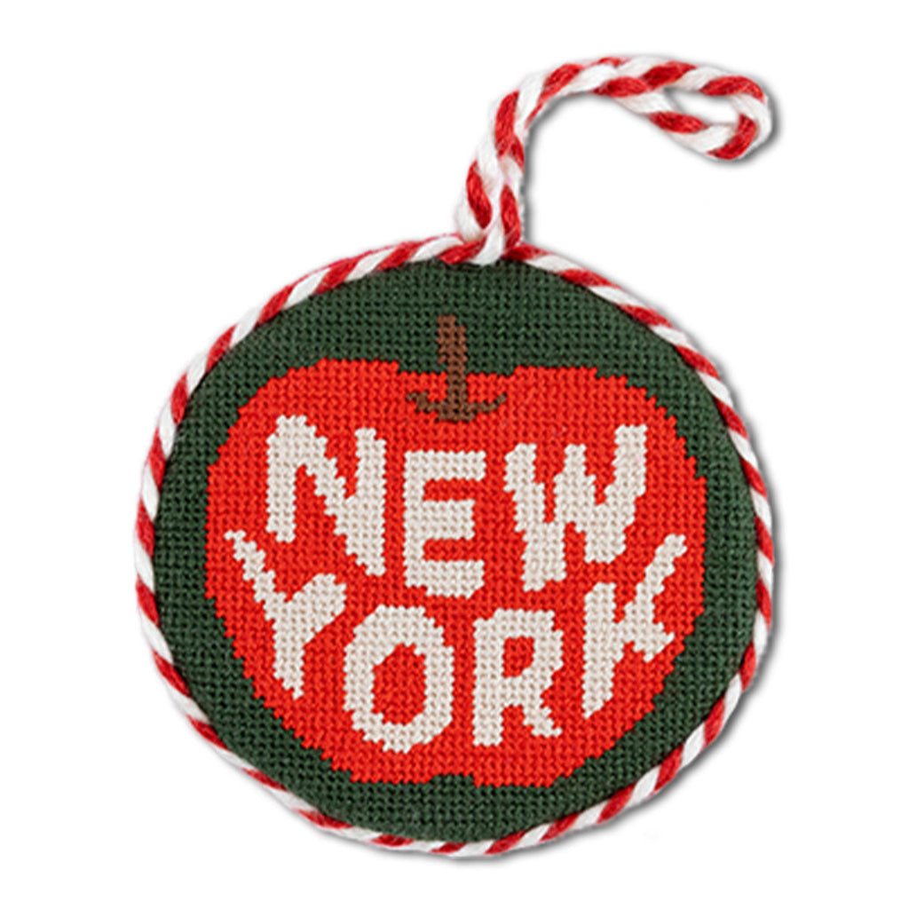 Round needlepoint ornament with 'New York' text on a white background