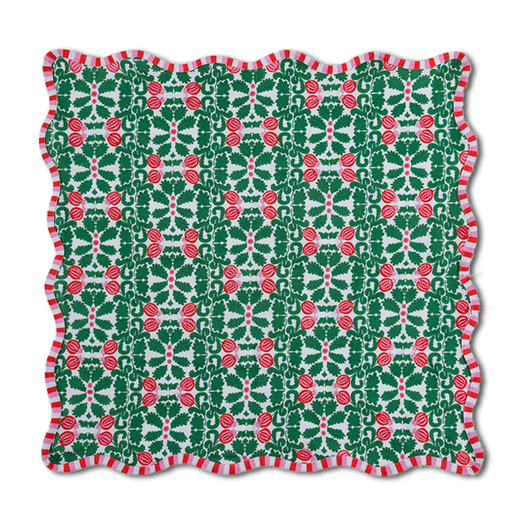 Christmas-themed fabric with red holly berries and green leaves on a white background