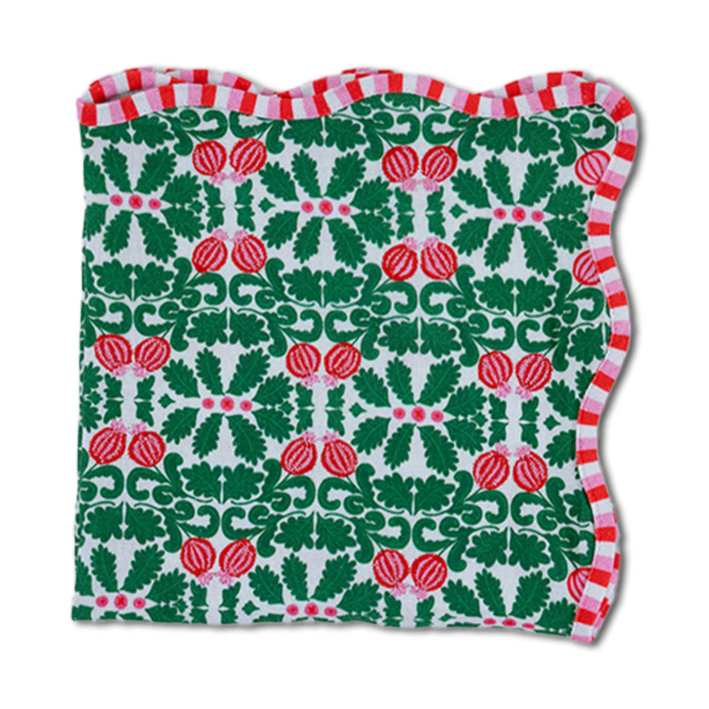 Festive towel with holly and berry pattern on a white background