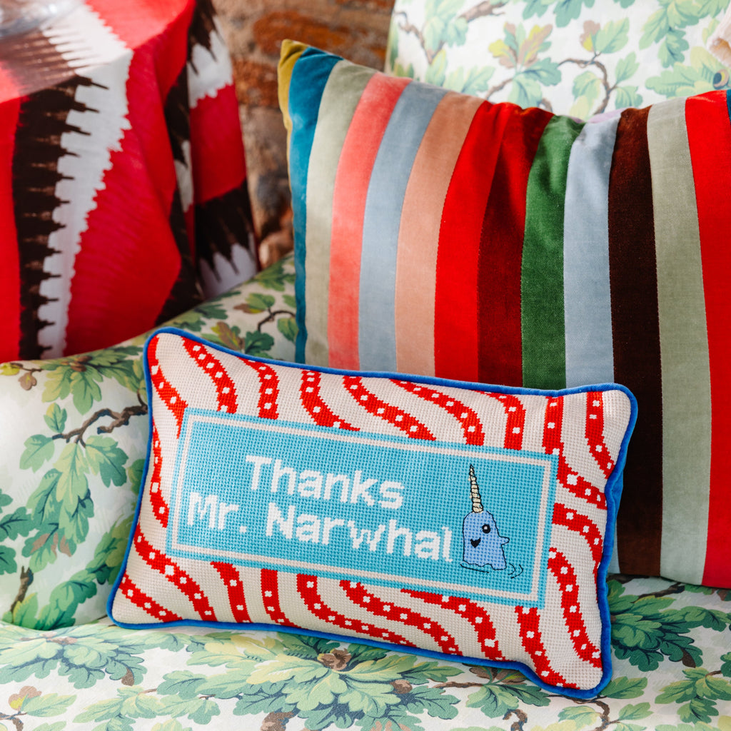 Decorative pillow with 'Thanks Mr. Narwhal' text on a floral background