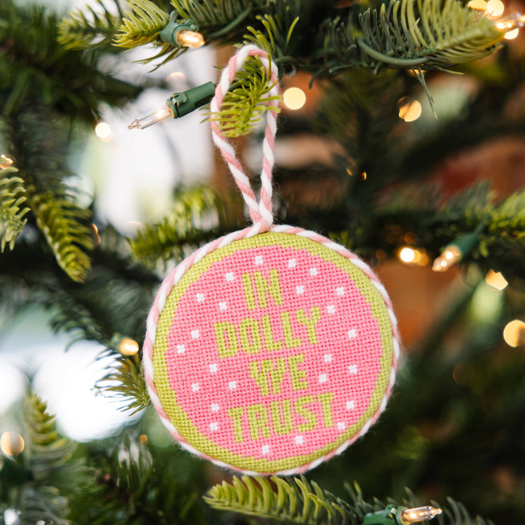 Decorative ornament with 'I'm only the host' text on a Christmas tree.