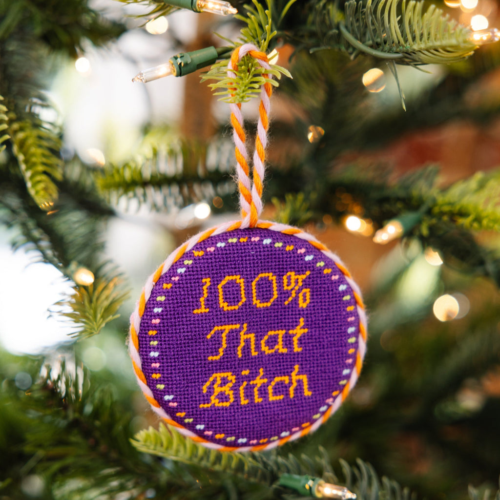 Decorative ornament with text on a Christmas tree