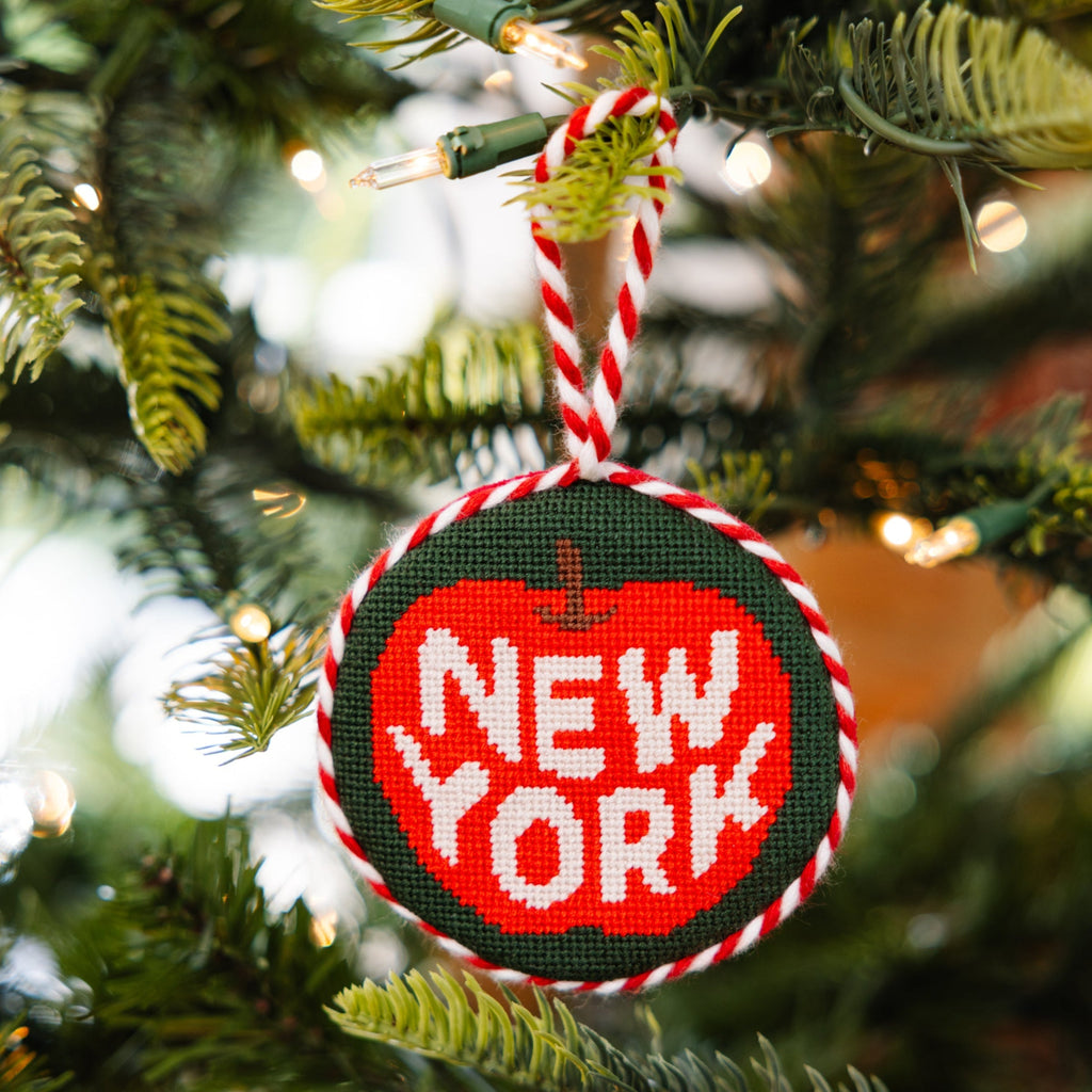 Decorative ornament with 'New York' text on a Christmas tree