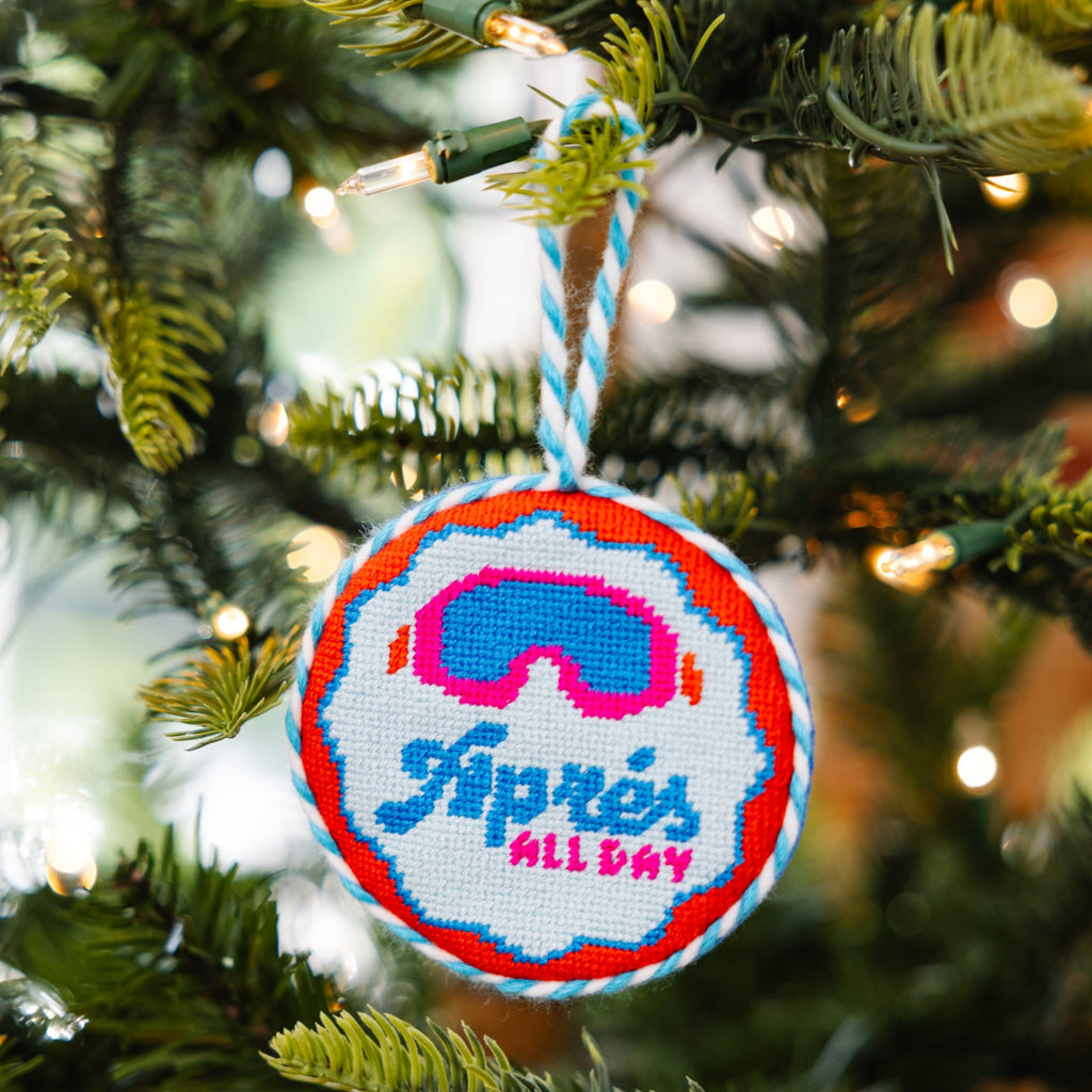 Decorative ornament with goggles and 'Siprés All Day' text on a Christmas tree.