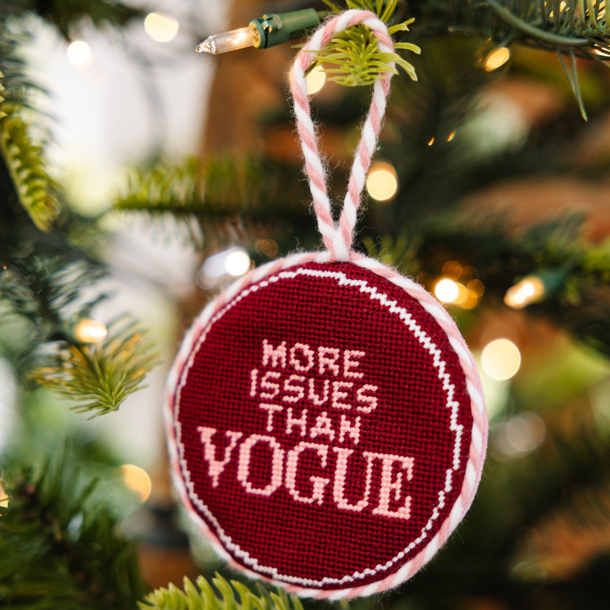 Decorative ornament with 'More Issues Than Vogue' text on a Christmas tree.