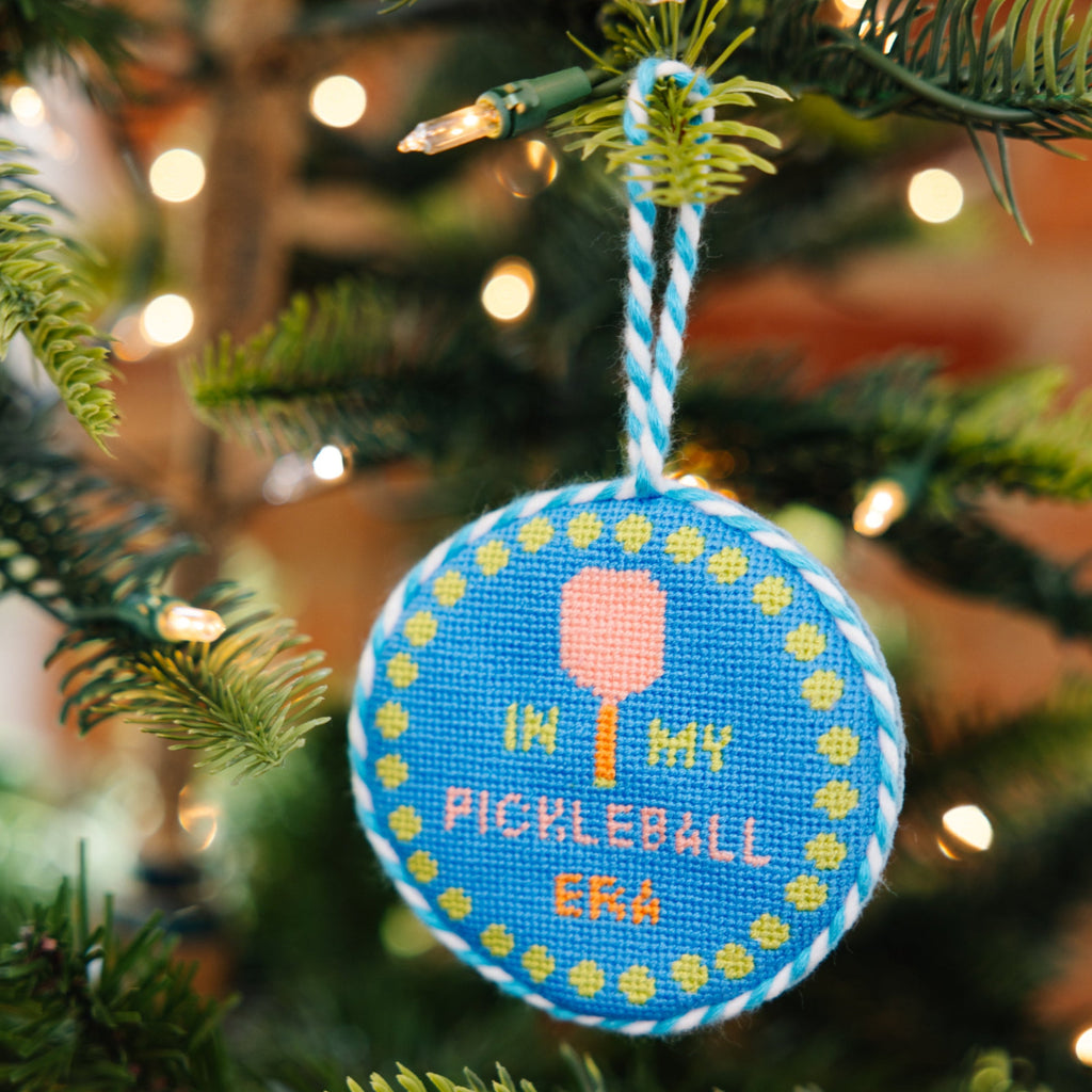 Decorative ornament with pickleball design on a Christmas tree