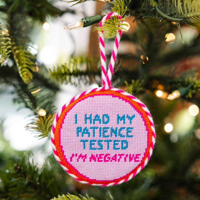 Decorative ornament with 'I had my patience tested. I'm negative.' text on a Christmas tree.