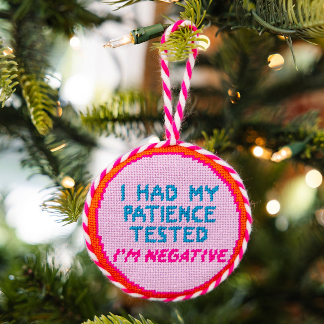 Decorative ornament with 'I had my patience tested. I'm negative.' text on a Christmas tree.