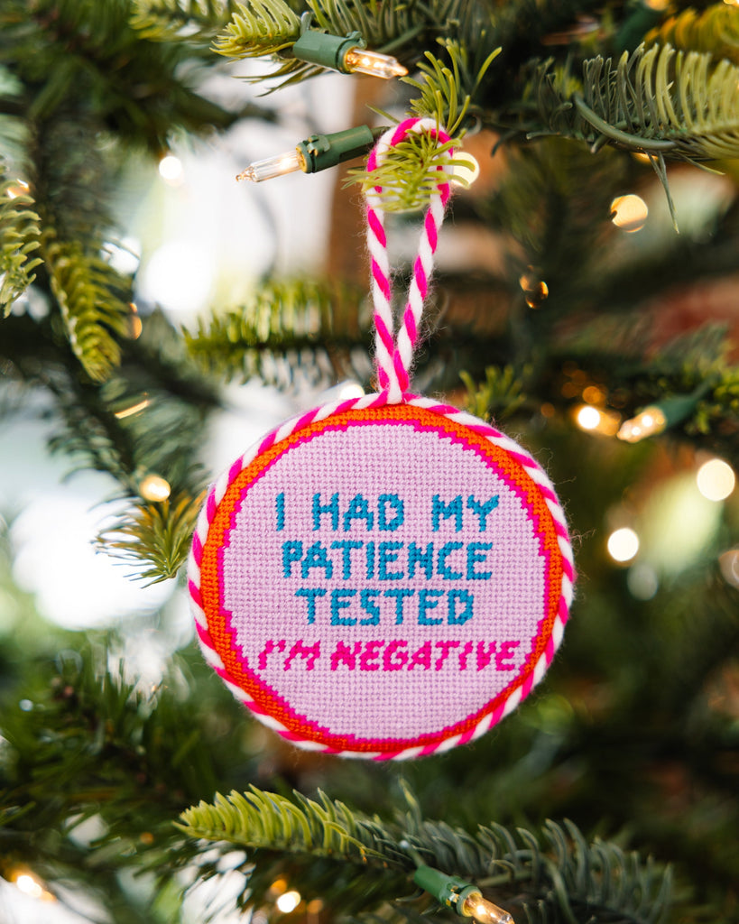 Decorative ornament with 'I had my patience tested. I'm negative.' text on a Christmas tree.