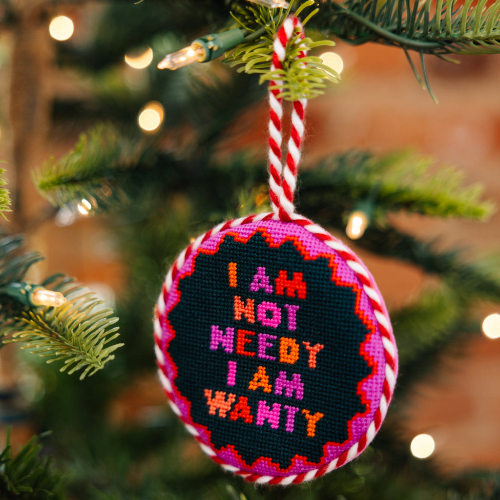 Decorative ornament with text on a Christmas tree
