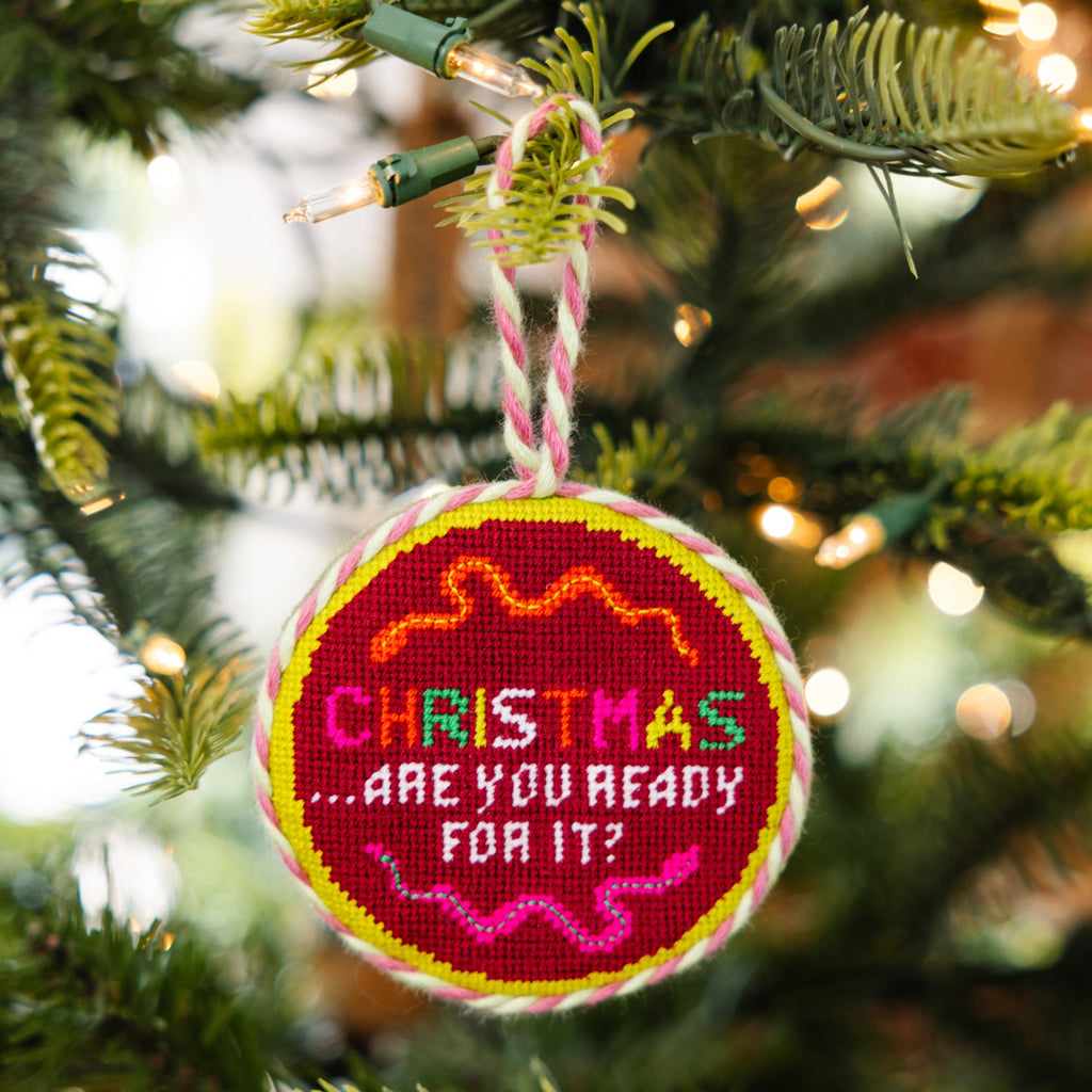 Decorative Christmas ornament with text on a tree