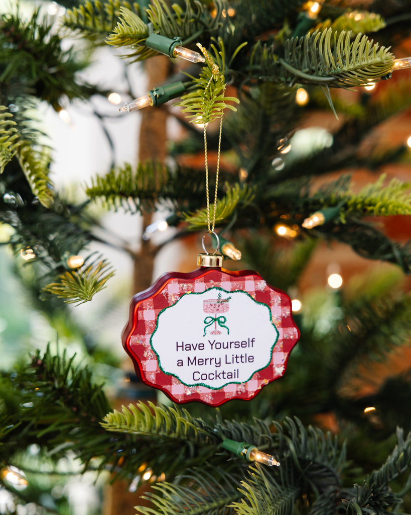 Decorative Christmas ornament with text on a tree