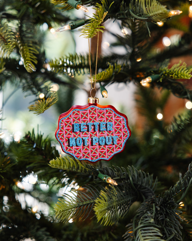Decorative ornament with 'Better Not Pour' text on a Christmas tree.