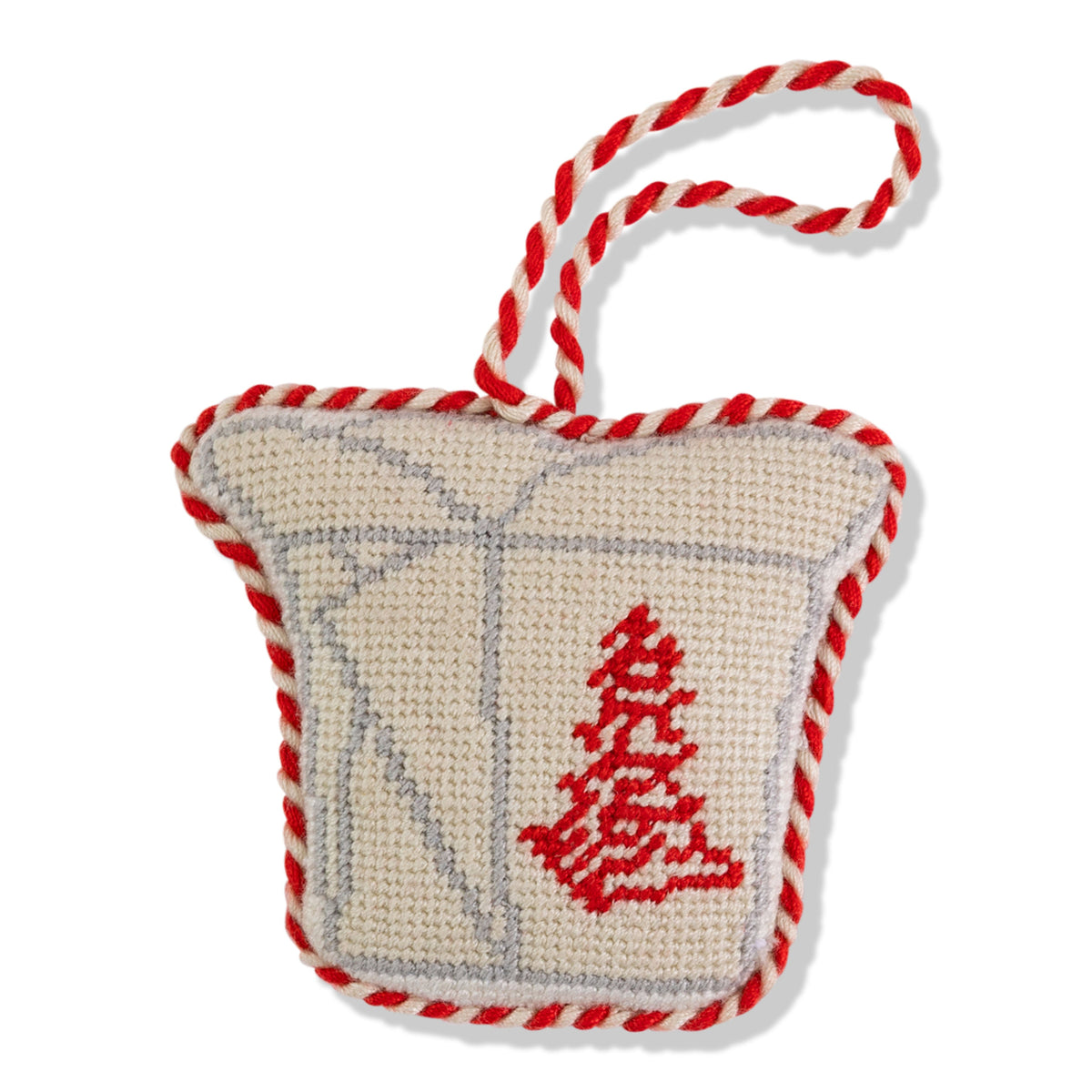 Decorative knitted ornament with red and white rope handle on a white background