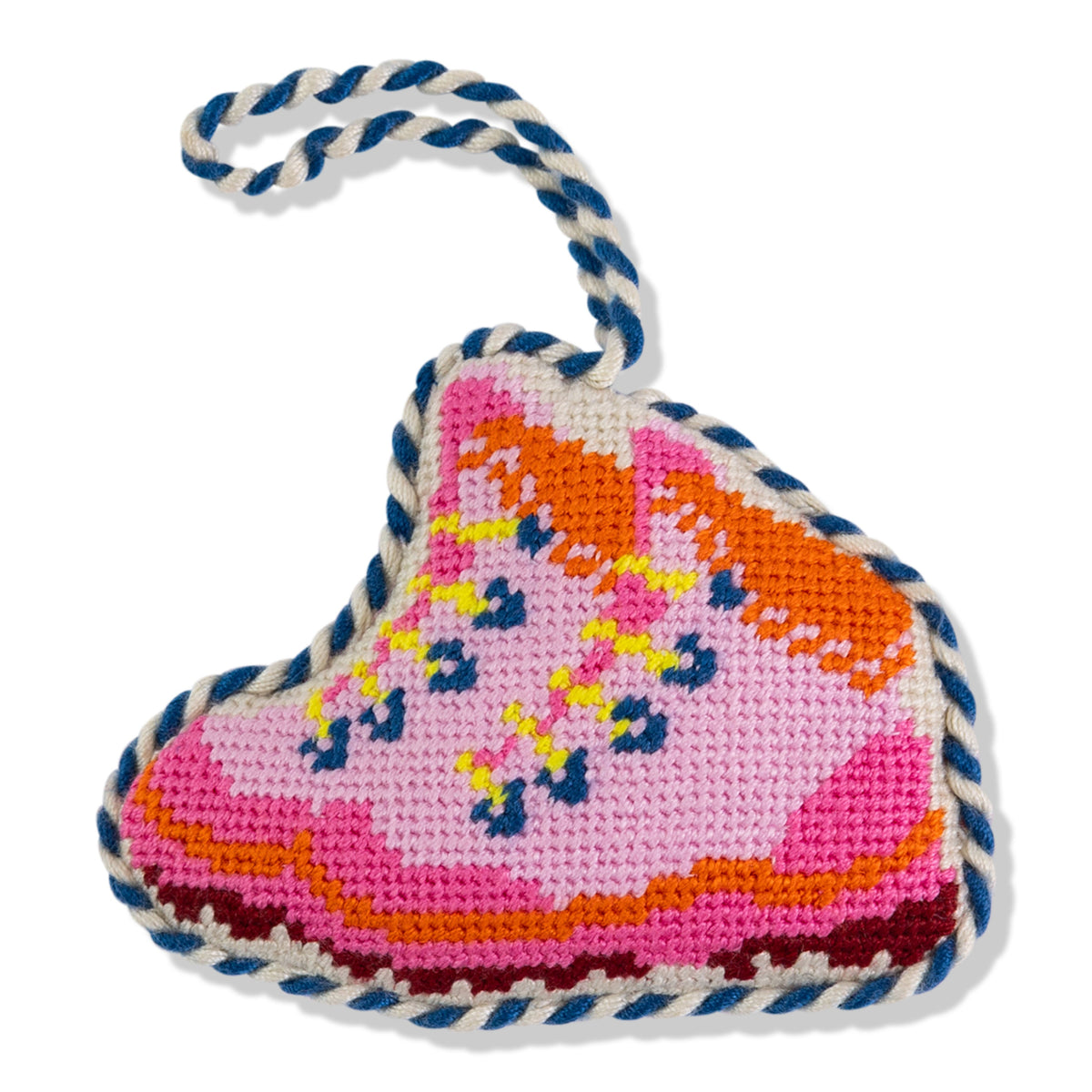 Heart-shaped knitted toy with colorful patterns on a white background