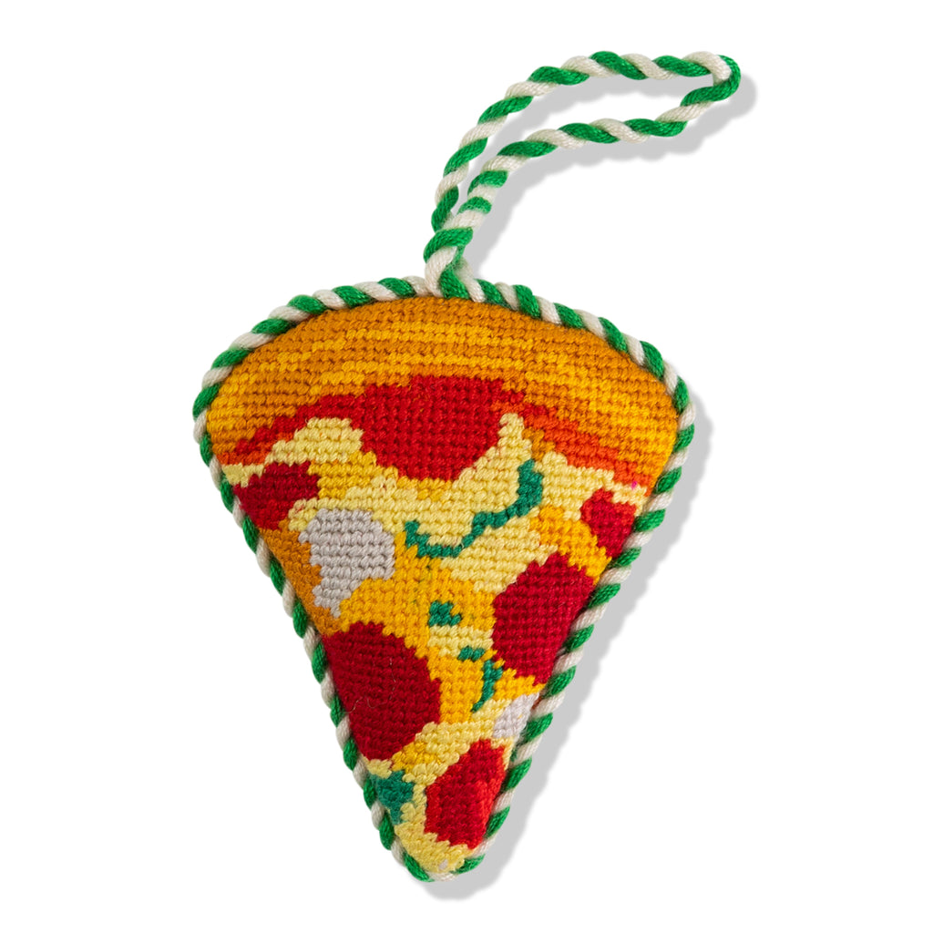 Triangular knitted toy with a colorful pattern on a white background