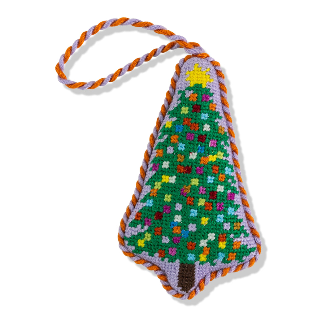 Colorful crocheted Christmas tree ornament with a braided handle on a white background