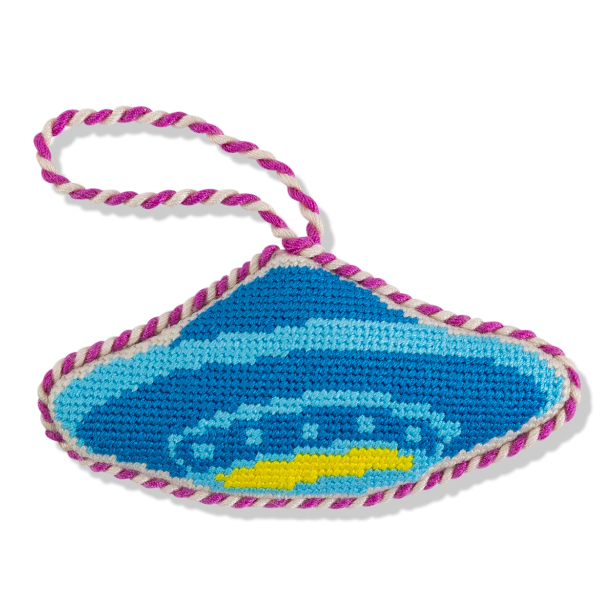 Blue and yellow car design on a knitted eye patch with pink and white trim.
