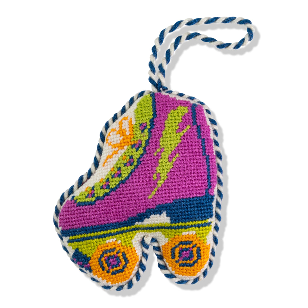 Colorful embroidered shoe-shaped keychain with a white background