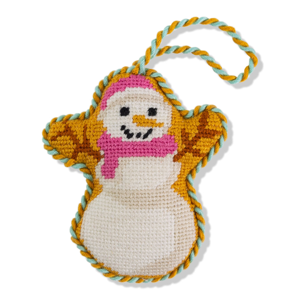 Crocheted snowman ornament with a pink scarf on a white background