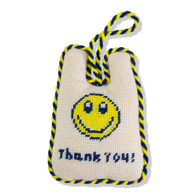 Textile product with smiley face and 'Thank You!' text on a white background