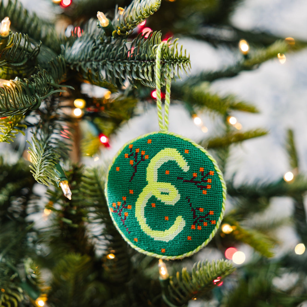Decorated Christmas tree with colorful ornaments and a star-shaped hanging decoration.