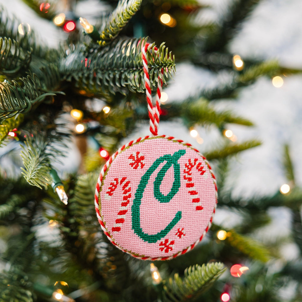 Decorative Christmas ornament with letter 'C' on a tree