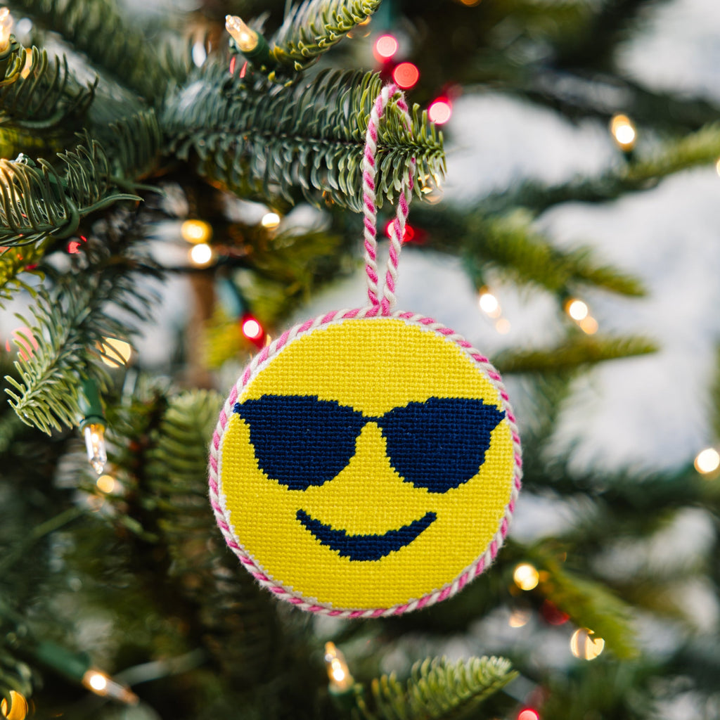 Decorative ornament with sunglasses on a Christmas tree