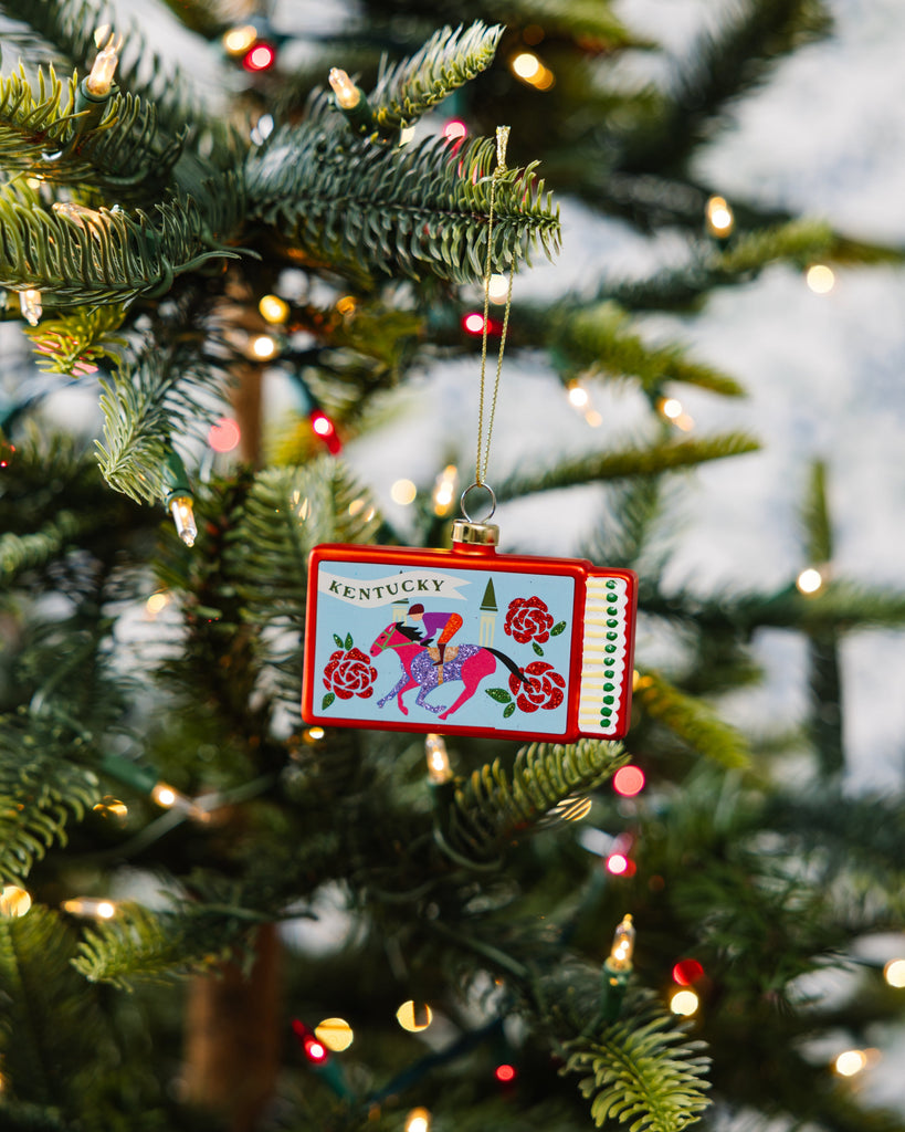 Christmas ornament with Kentucky design on a decorated tree