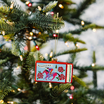 Christmas ornament with Kentucky design on a decorated tree