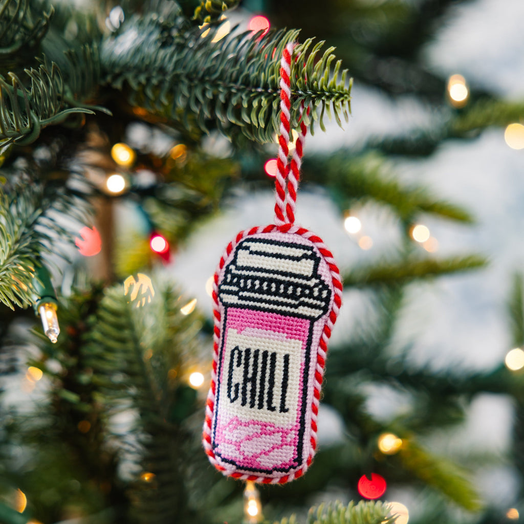 Decorative ornament with 'CHILL' text on a Christmas tree